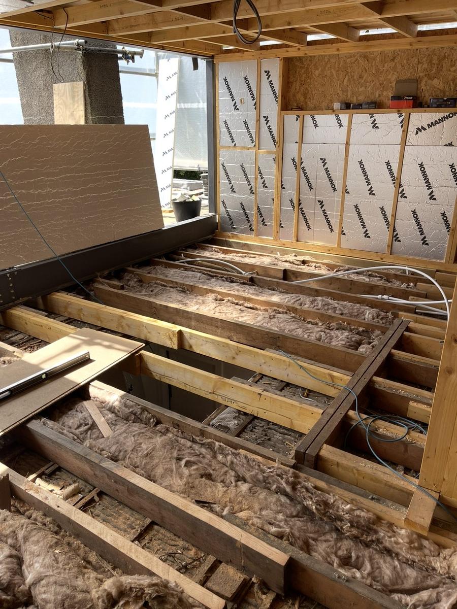 PIR boards between wall studs and mineral wool in the floor joists, The Grange