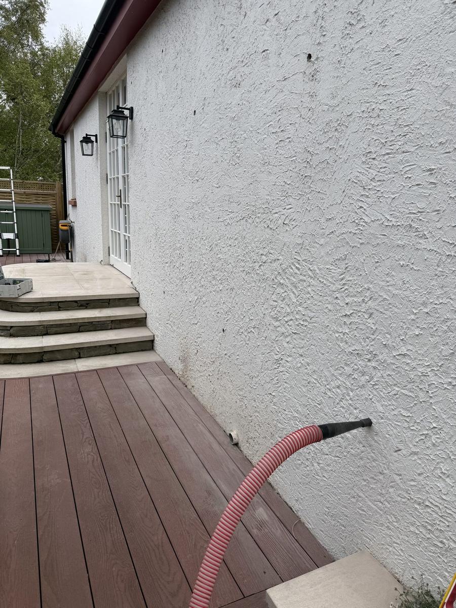 Damp, aged cavity wall insulation being removed